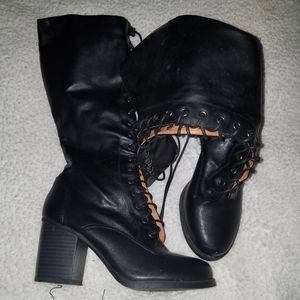 Calf length black heeled boots